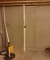 Interior radon mitigation system in basement