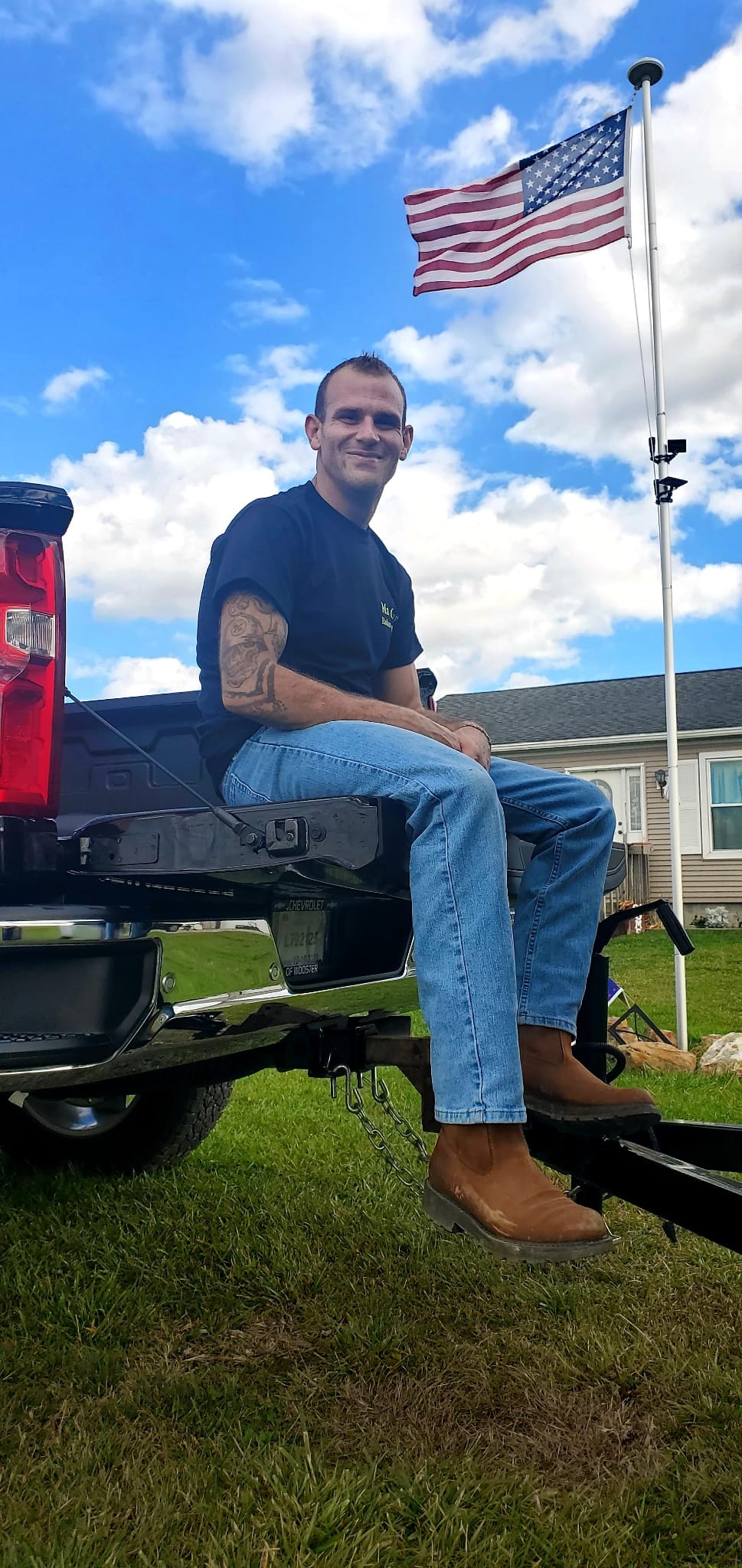 Matthew Gray sitting on radon company truck